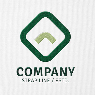 Close up of embroidered logo on white customised t-shirt.