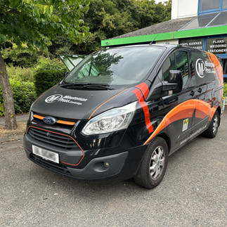 Old vehicle graphics design on Minuteman Press Cambridge van before rebranding