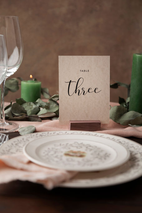 Printed table number in a wooden block holder.