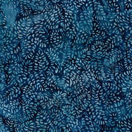 densly packed pinecones on dark blue batik