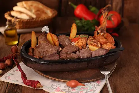 Delicious mixed grill platter: lamb, chicken, potatoes