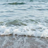 close up on waves gentle lapping the shore. just want no horizon.jpg