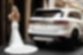 Default_a_close_up_photo_of_a_luxury_suv_pulling_up_to_a_hotel_0 Upscaled.jpg