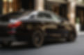 Default_a_close_up_photo_of_a_car_pulling_up_to_a_hotel_entran_0.jpg