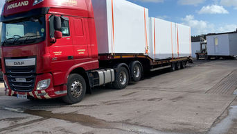 Prefabricated modules secured with protective wrap for safe transport