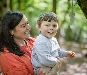 Mother and son family photograph by a tree in Highgate Wood