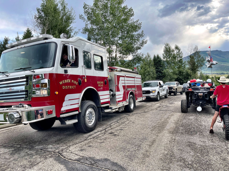 Fire and Sherriff apparatus lined up on road for parade.