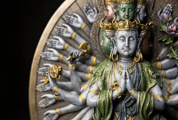 gold and green hindu deity statue
