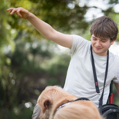 Smiling man with a golden retriever
