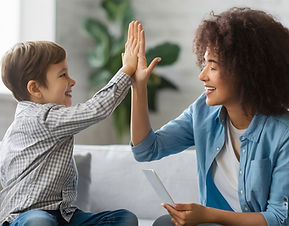 cheerful-mother-giving-highfive-her-small-son-home.jpg