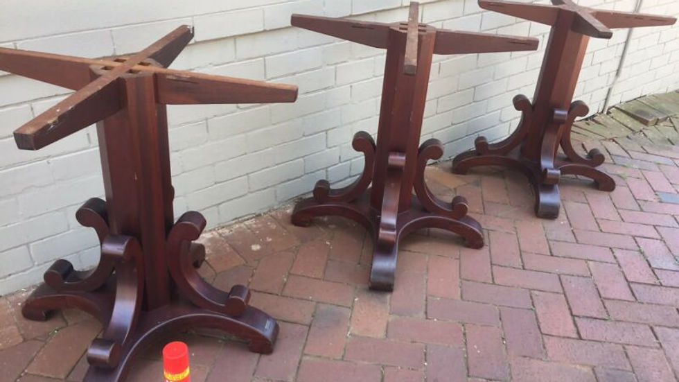 Close-up view of intricately carved wooden table leg