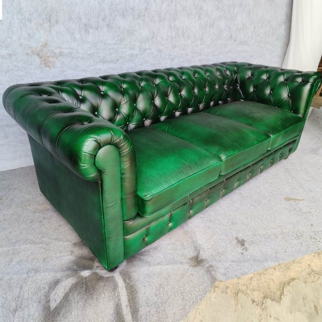 green leather chesterfeild sofa
