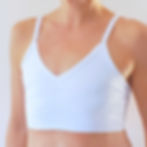 Thumbnail: the busted tank basic beauty pocketed mastectomy bra white worn flat without breast forms