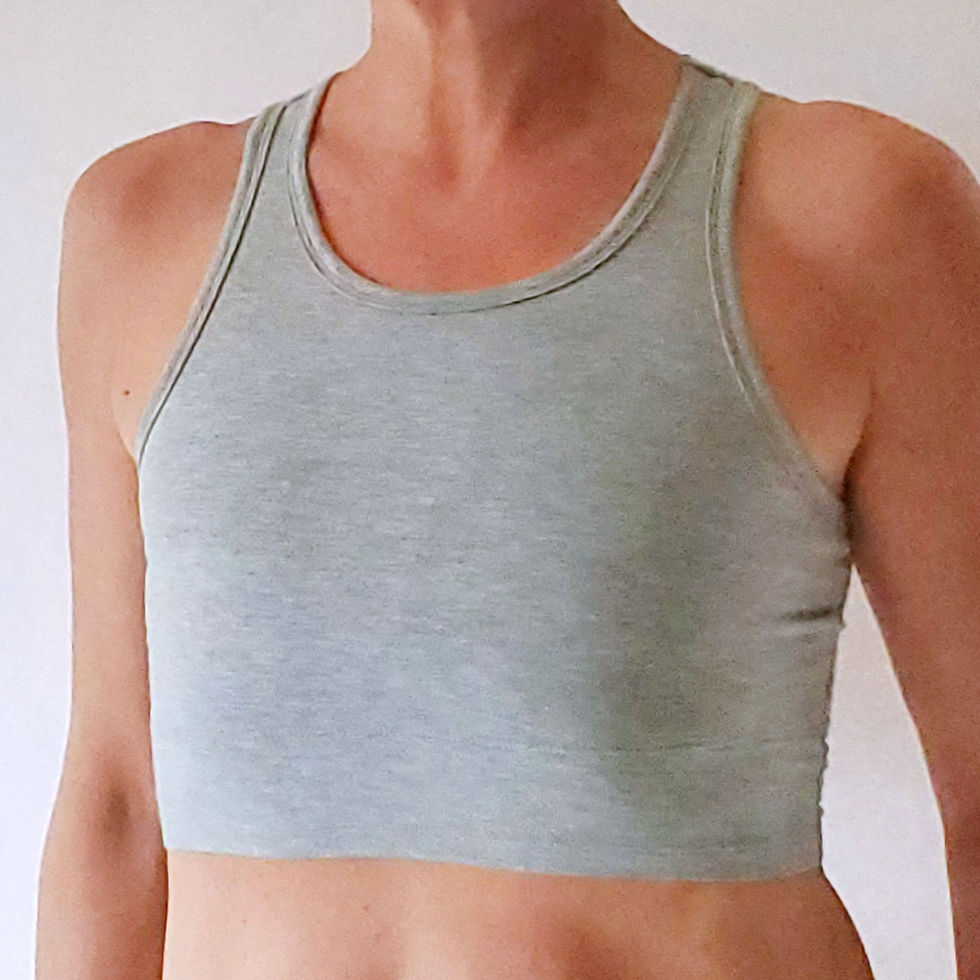 Thumbnail: the busted tank pocketed mastectomy racerback sports bra heather gray worn as flat bra