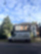 Roofing van parked outside a house