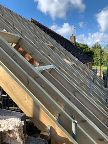 Roof installation carpentry with window frames in Basingstoke