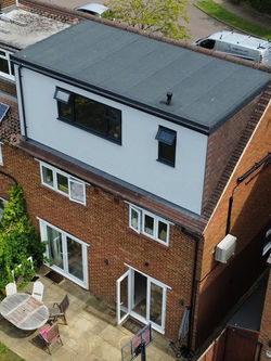 Aerial view of property featuring new flat roof dormer conversion and back garden