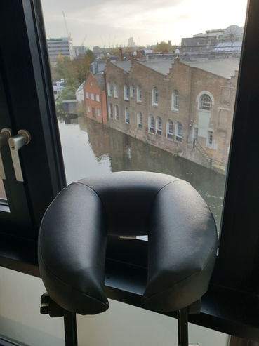 Massage chair with view over canal