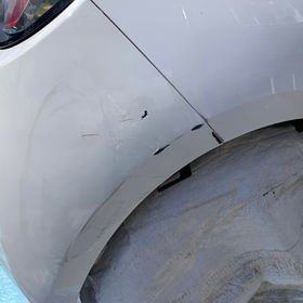 Scratched on white car
