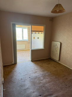 Empty room after house clearance showing bare floor.