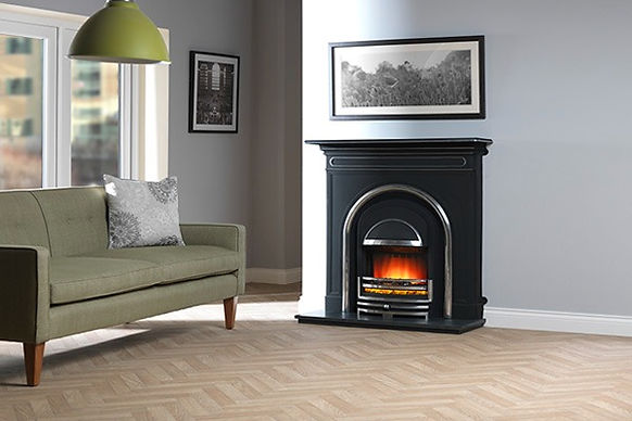 Electric fire cast insert in fireplace