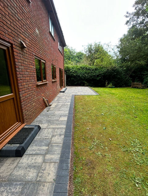 Newly installed path in garden along side of house