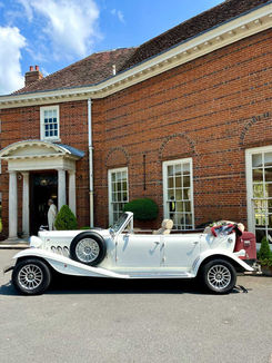 White classic car at wedding venue
