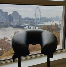 Massage chair at central London office with view of the London Eye