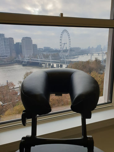 Massage chair at central London office with view of the London Eye