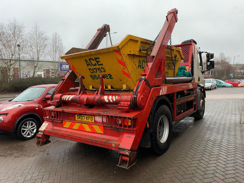 Red skip lorry
