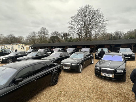 Fleet of luxury black vehicles