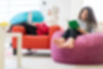 Two girls reading on bean bags