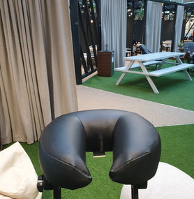 Massage chair in garden space of office
