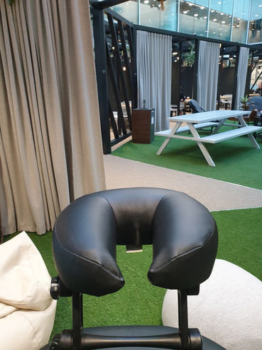 Massage chair in garden space of office