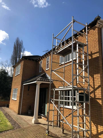 Scaffolding on house for roofing work