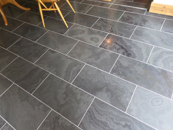 Grey stone tiled floor after cleaning