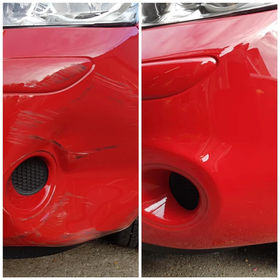 Red car being repaired