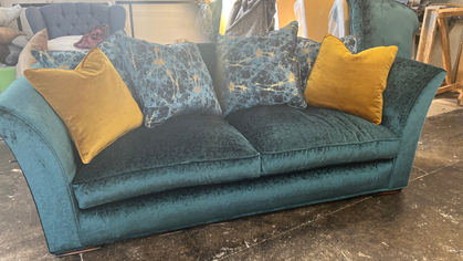Green re-upholstery of sofa with yellow velvet cushions