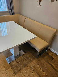 Cream bench seating, upholstered in leather