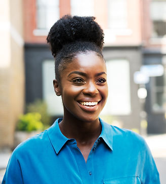 Young smiling woman with blue top