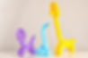 Animal figures made of modelling balloons on table against color background_edited.jpg