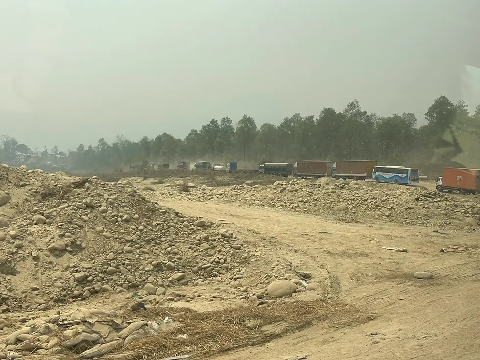Heavy traffic on the replacement road close to damaged Binayi Khola Bridge