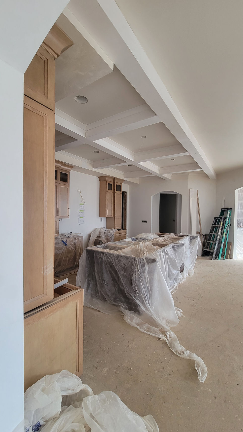 White coffered ceiling with recessed square panels and clean trim details.