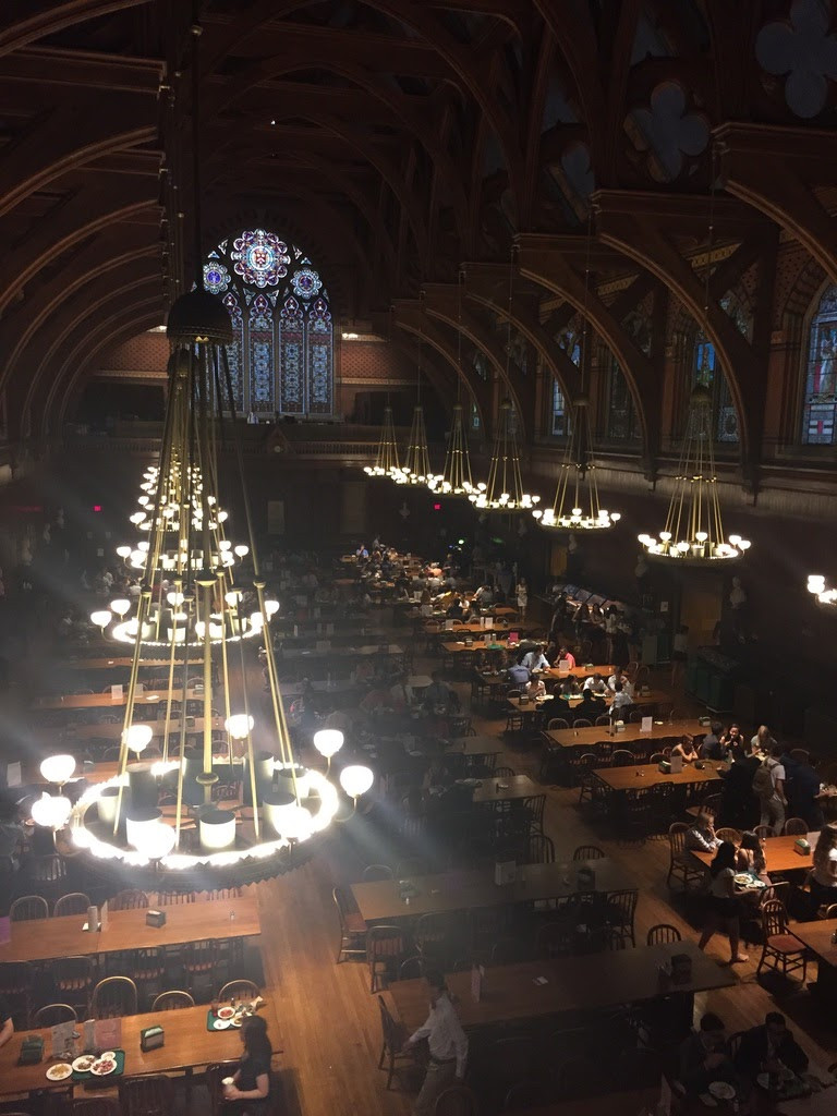 Taken from the second level of Annenberg, with several students pictured eating lunch on the lower level.