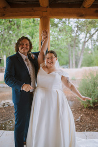 A couple celebrates after their wedding ceremony at their Chimayo, New Mexico elopement.