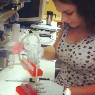 Erica Keane Rivera conducting stem cell research as a high school intern