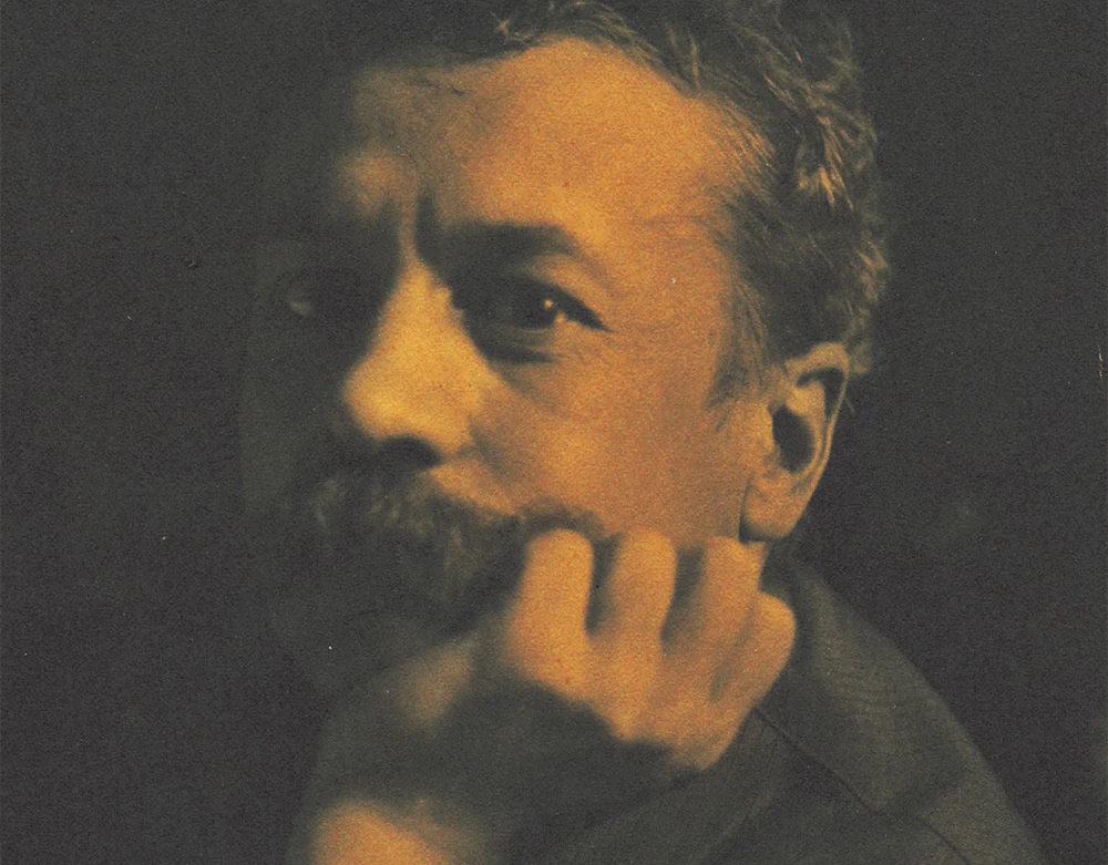 Renen Lalique sitting in a thinking position
