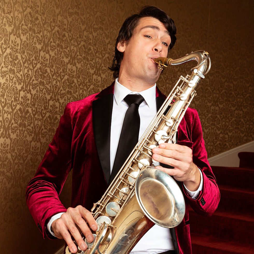 nyc non traditional wedding djs with Live Musicians Man in a burgundy velvet jacket plays a saxophone in front of ornate brown wallpaper, looking focused.