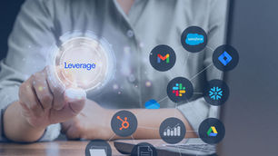 Person touching holographic interface with text "Leverage" and app icons like Gmail, Slack. Office setting, tech network vibe.