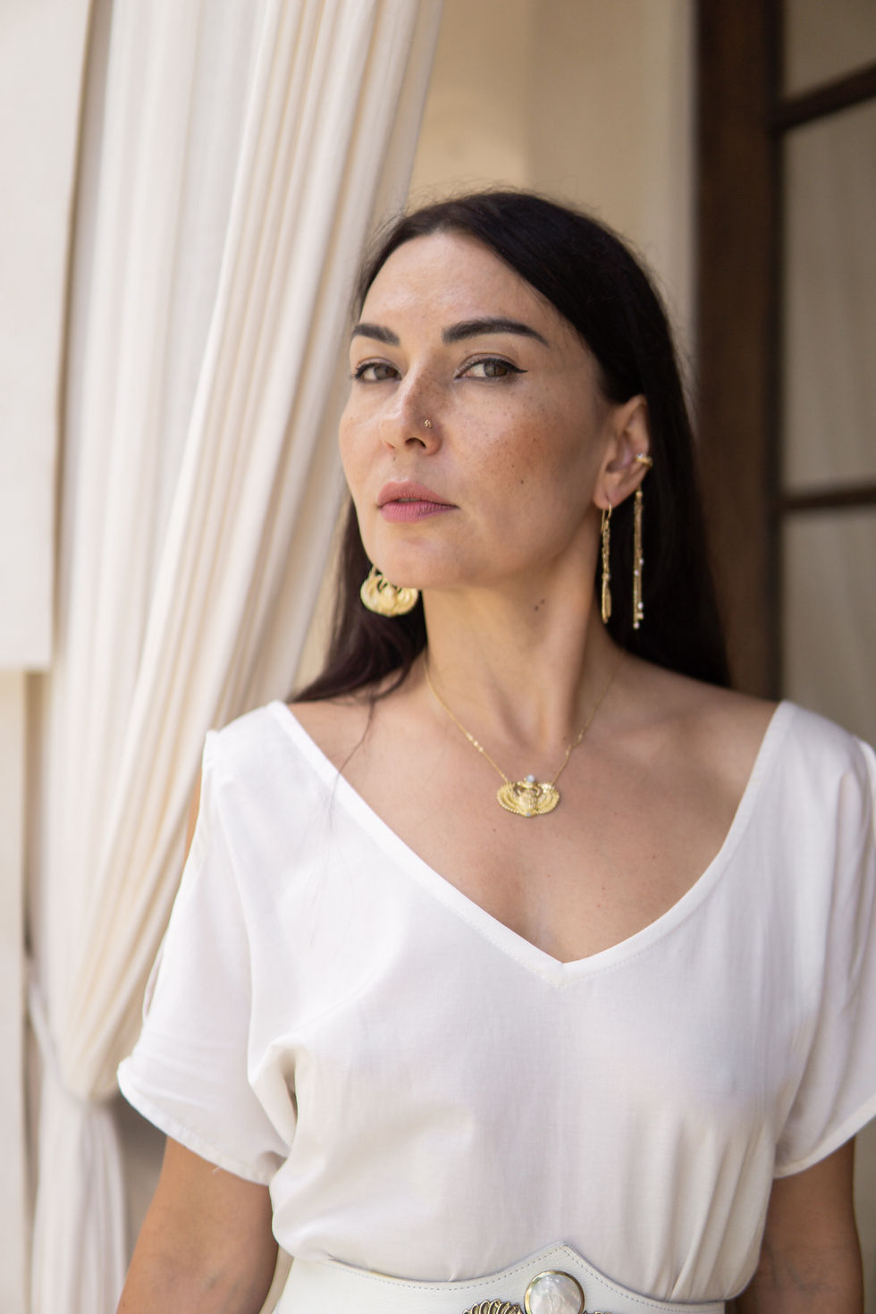 Thumbnail: WOMAN WEARING THE SCARAB EARRING mixed with Dragon earcuffs
